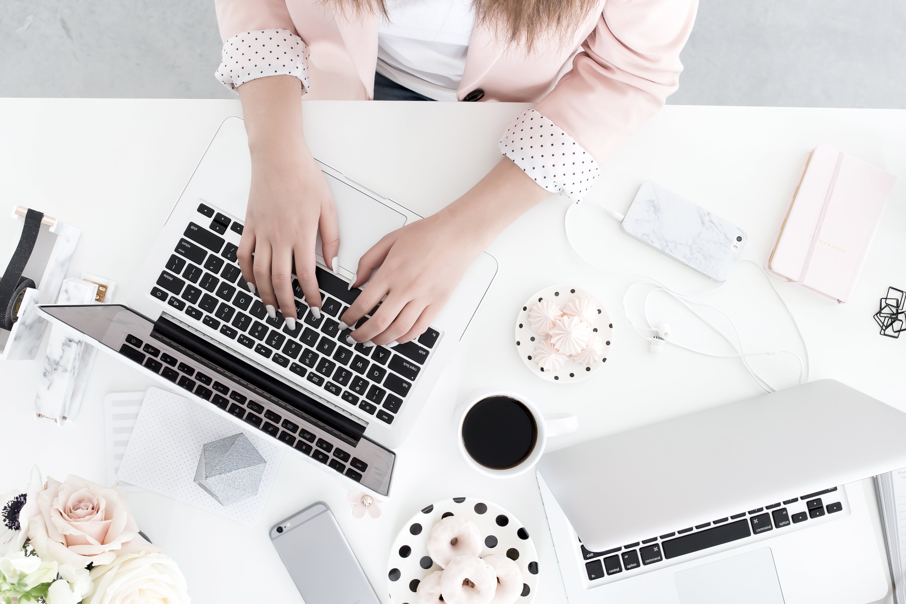 Overhead of woman typing on a laptop