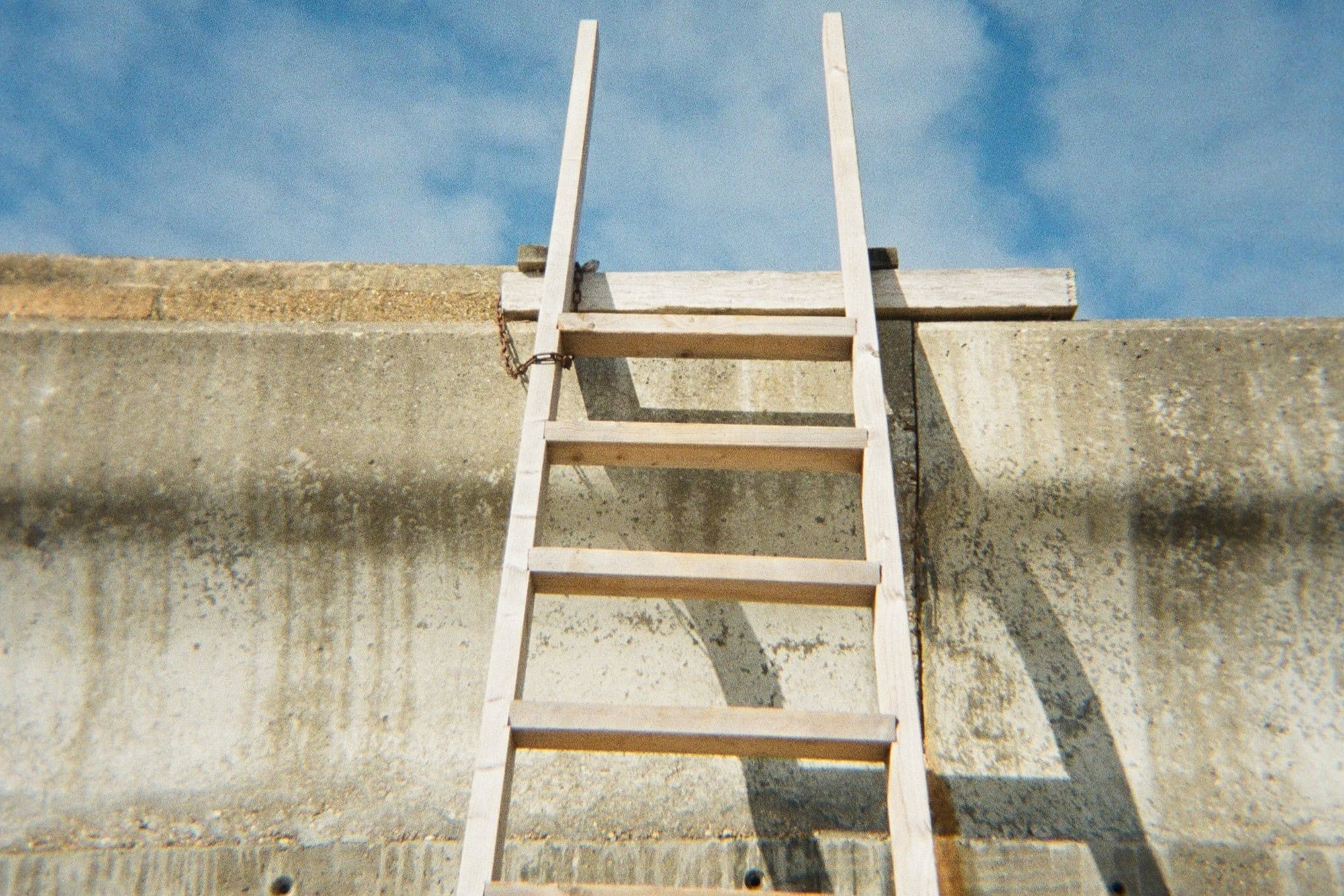 Ladder leaning against a wall